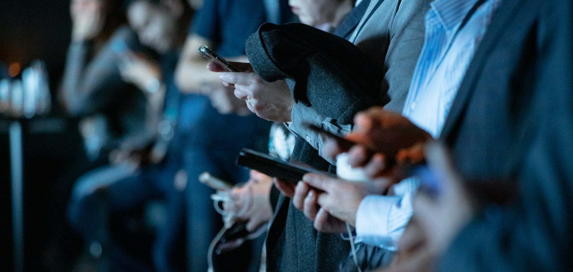 people using phone while standing