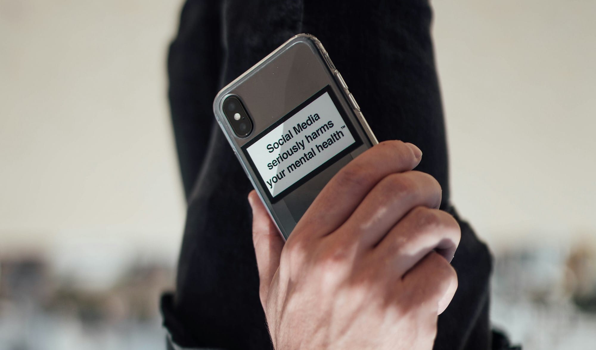 person holding black iphone 4